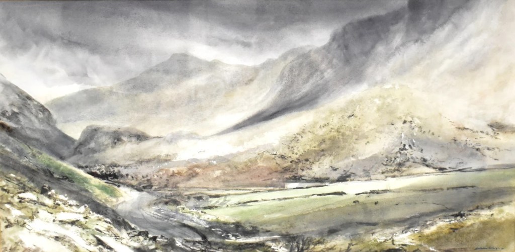 Signed 1991 watercolour of the Llanberis Pass by William Selwyn, displayed in the hallway at Min y Don Llandudno, North Wales