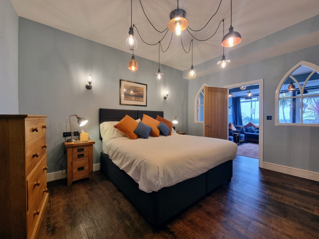 Bedroom view into lounge and garden towards the Little Orme in Suite 101